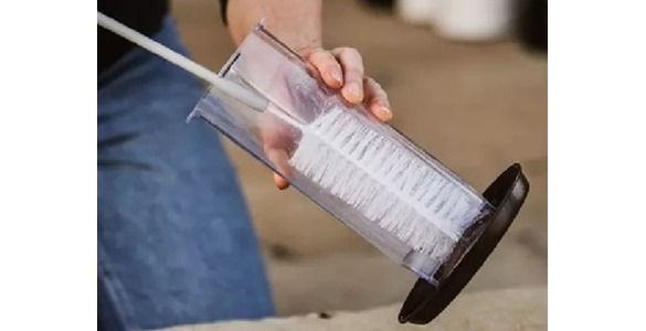 Cleaning a bird feeder
