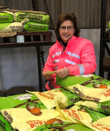 Lesley boxing up bird feed orders to be shipped